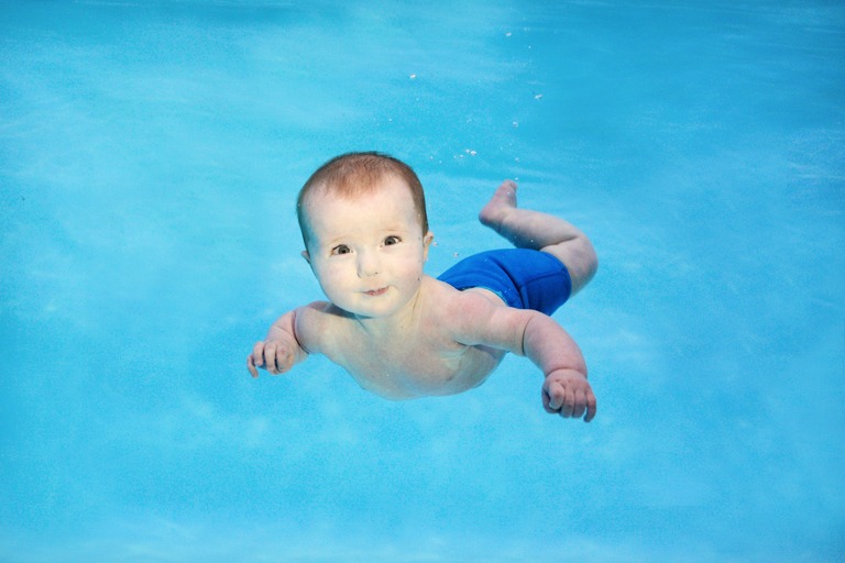 baby swimming underwater