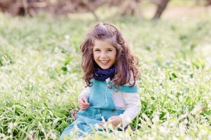 little girl in a field of wild garlic